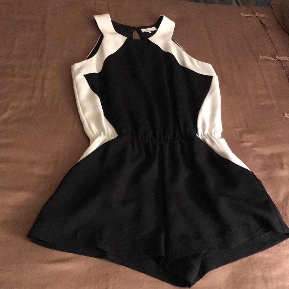 Black and white short jumpsuit. Very cute!